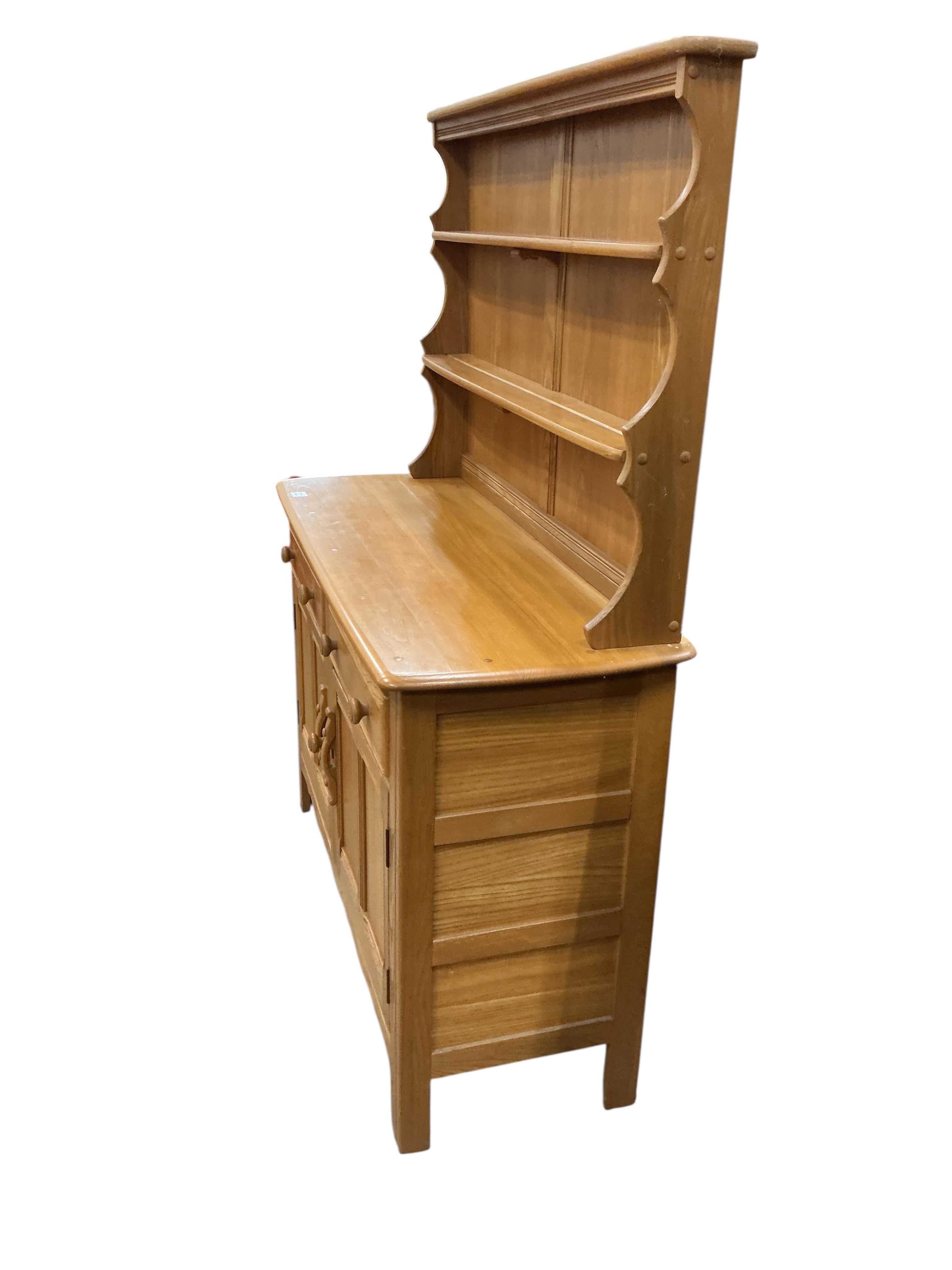 An Ercol light elm dresser, width 122cm, depth 46cm, height 161cm